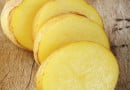 Potato slice on wooden background