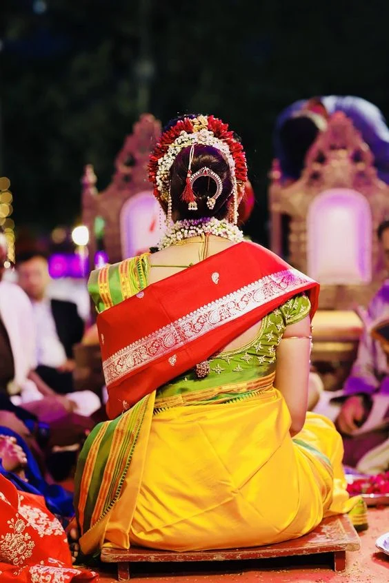 Maharashtrian Bridal Hairstyles bridal hairstyle, wedding hairstyle, maharashtrian bride, indian bridal hairstyles, elegant hairstyle, marathi bridal hairstyles, braided bun, wedding day, bun hairstyle, open hair, marathi bride, baby breaths