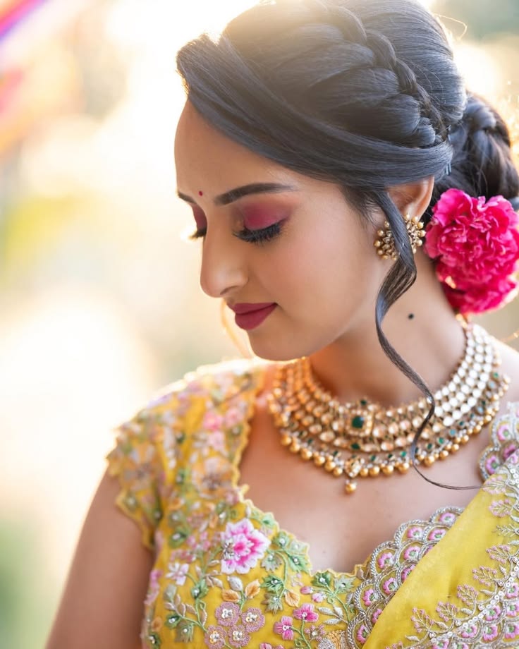 Braided Bun With puff hairstyle for saree
